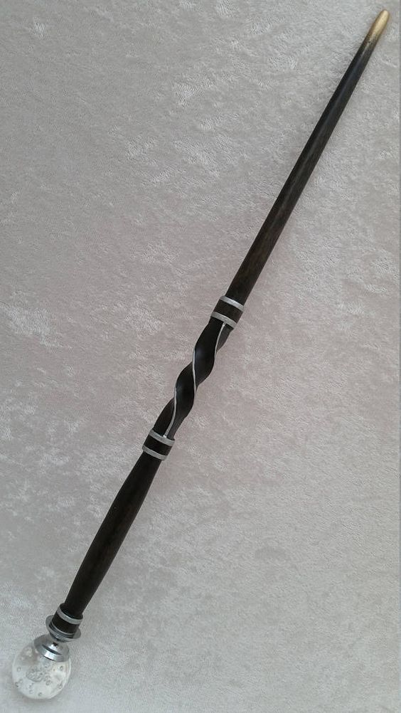 Yes, I said Wand. The "hair pin" is what Perdita calls her "Utility Wand." That is, it's a Wand that is enchanted to do various utilitarian Spells, like stick things together, light a fire, turn screws that have been stripped (she HATES those,) & other practical tasks.