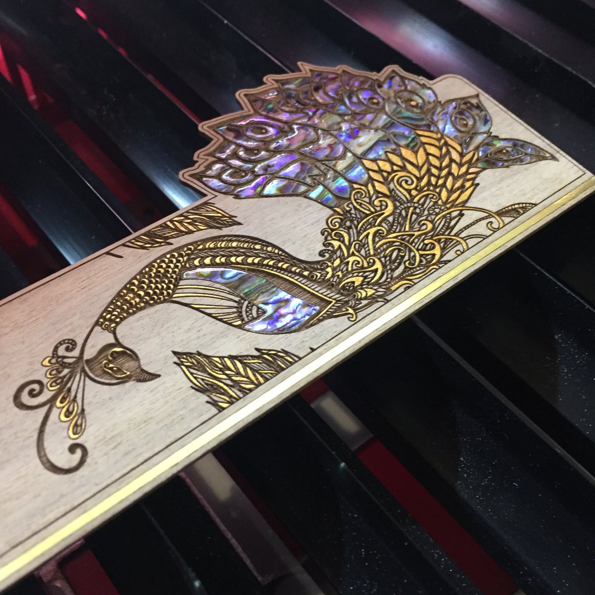 HPCLaser's tweet image. A client made this stunning bookmark using Mother of Pearl inlays and gold paint on walnut 🦚

#lasercut #design #laser #engraving