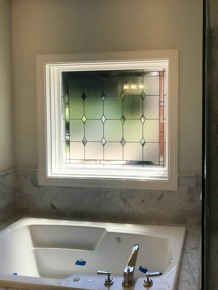 A great example of a ProVia stained glass window installed in Naperville. The perfect option for privacy in the bathroom. Let us help with your next project! Contact a Design and Energy expert today: j.mp/2fMFGAs. #nextdoorandwindow #proviawindows