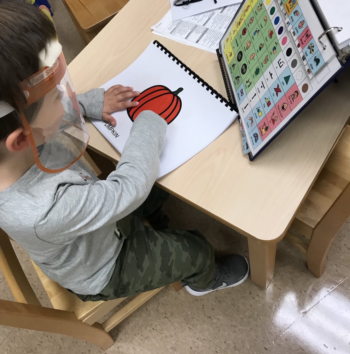 Learning about pumpkins using core board and pumpkin concept book in preschool! CHSTRONG CHPROUD