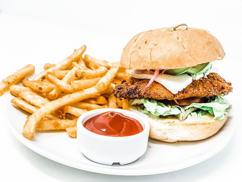 Seriously satisfying fried chicken sandwich. 🍗🔥 with Frank’s hot aioli, lettuce, tomato, bread and butter pickles.