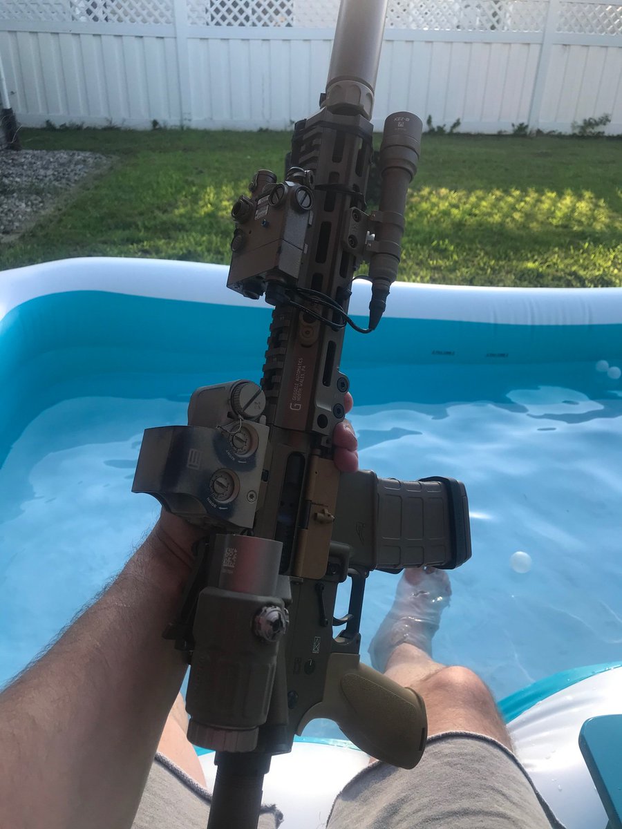 Sometimes, when he is off-duty, Jon likes to squat in his inflatable pool in his fenced-in yard and fondle his fancy rifle.