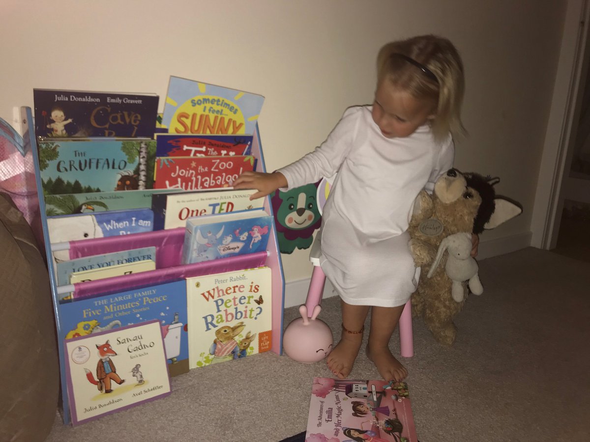 rhosstreet's tweet photo. Choosing the right bedtime story is an important task for this Nursery pupil! #RuthinLibrary @DenbsLibs #RSSlit #WythnosLlyfrgelloedd #LibrariesWeek #lovereading https://t.co/1r5713qQhj