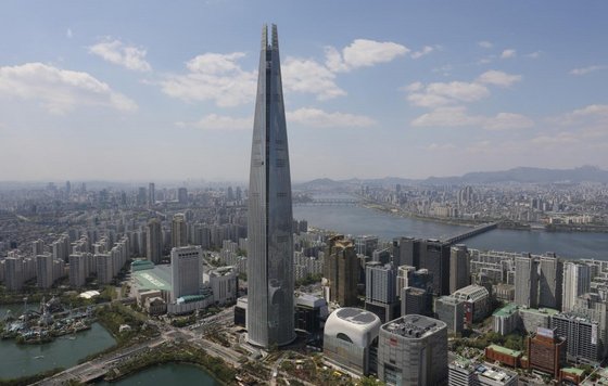 1. Lotte TowerThe MV starts with a distant view of this building towering over landscape of Seoul. With its 556-memter height, the skyscraper is the tallest building in South Korea (located in Jamsil). I remember construction of this tower was quite controversial back then