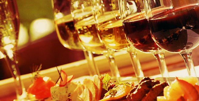 closeup of food and glasses of wine