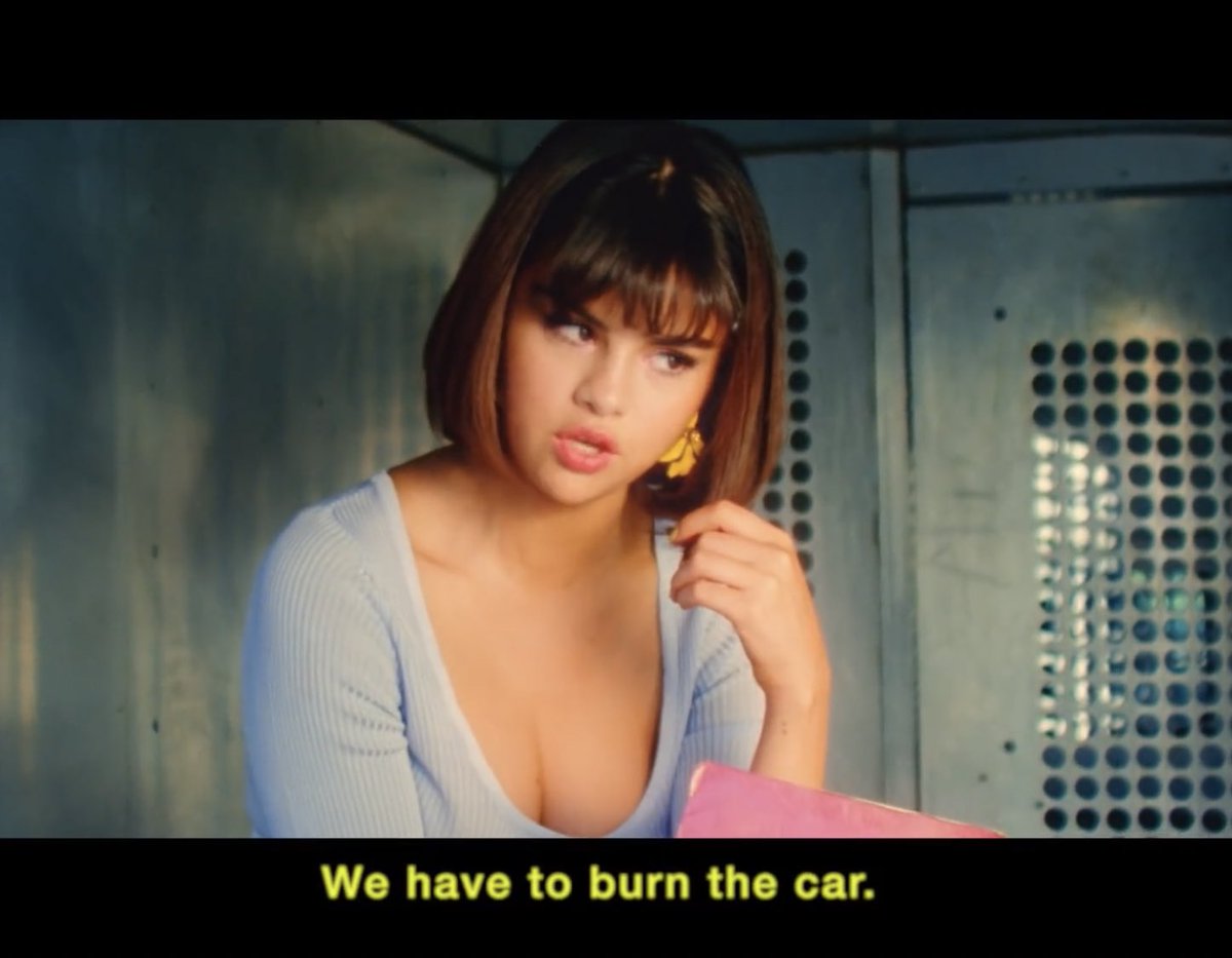 Selena and the guy go back & forth about the car (the relationship), due to her insecurities about his commitment (the infidelity book) that at the end Selena compulsively just ends the feud with burning the car. Her going back to JB can represent that final burn.