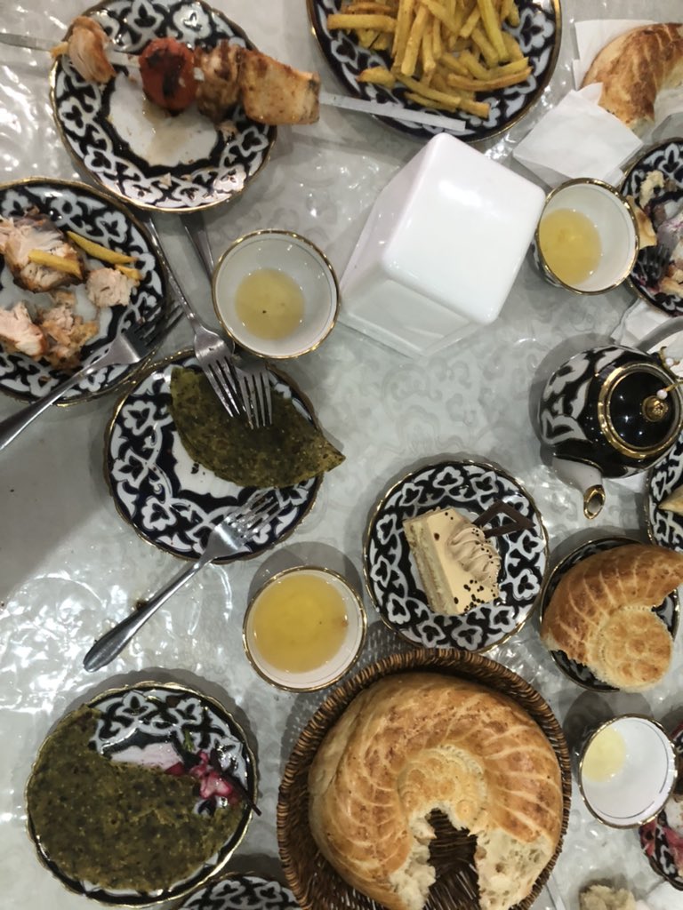 Uzbek family enjoys a meal. Uzbekistan has a large Tajik population who trace roots to Iran. Like India a distinct Persian influence is apparent. E.g the Somsa or Sanbosag in Persian. Unlike India the local influence is less -what you see is more akin to original Persian food.