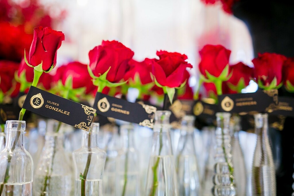 atelierazure's tweet photo. “What a first impression! The guests loved walking into the reception to be greeted by a sea of red rose escort cards. Each rose/place card was kept in an individual vase. We asked our guests to be dressed in black-tie and black and white only. The red r… https://t.co/SG988HXzRD https://t.co/8ZAkrhXgRn