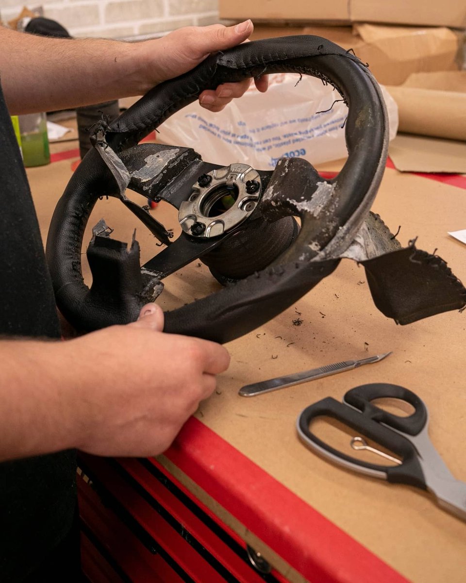dclassauto's tweet image. Audi S2 steering wheel retrim today. This wheel had been previously retrimmed and had some body filler hiding underneath. Not ideal but sure enough we corrected this and trimmed the wheel in black nappa leather with matching stitching. Extra cushioning was also added.