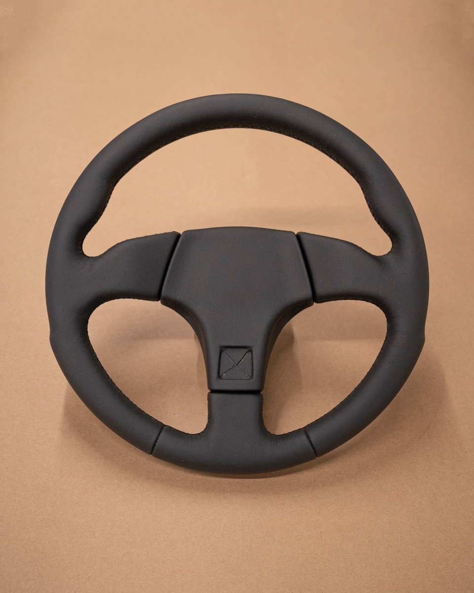 dclassauto's tweet image. Audi S2 steering wheel retrim today. This wheel had been previously retrimmed and had some body filler hiding underneath. Not ideal but sure enough we corrected this and trimmed the wheel in black nappa leather with matching stitching. Extra cushioning was also added.