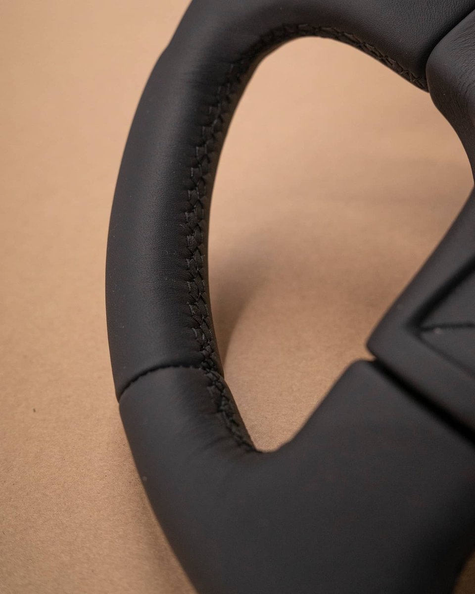 dclassauto's tweet image. Audi S2 steering wheel retrim today. This wheel had been previously retrimmed and had some body filler hiding underneath. Not ideal but sure enough we corrected this and trimmed the wheel in black nappa leather with matching stitching. Extra cushioning was also added.