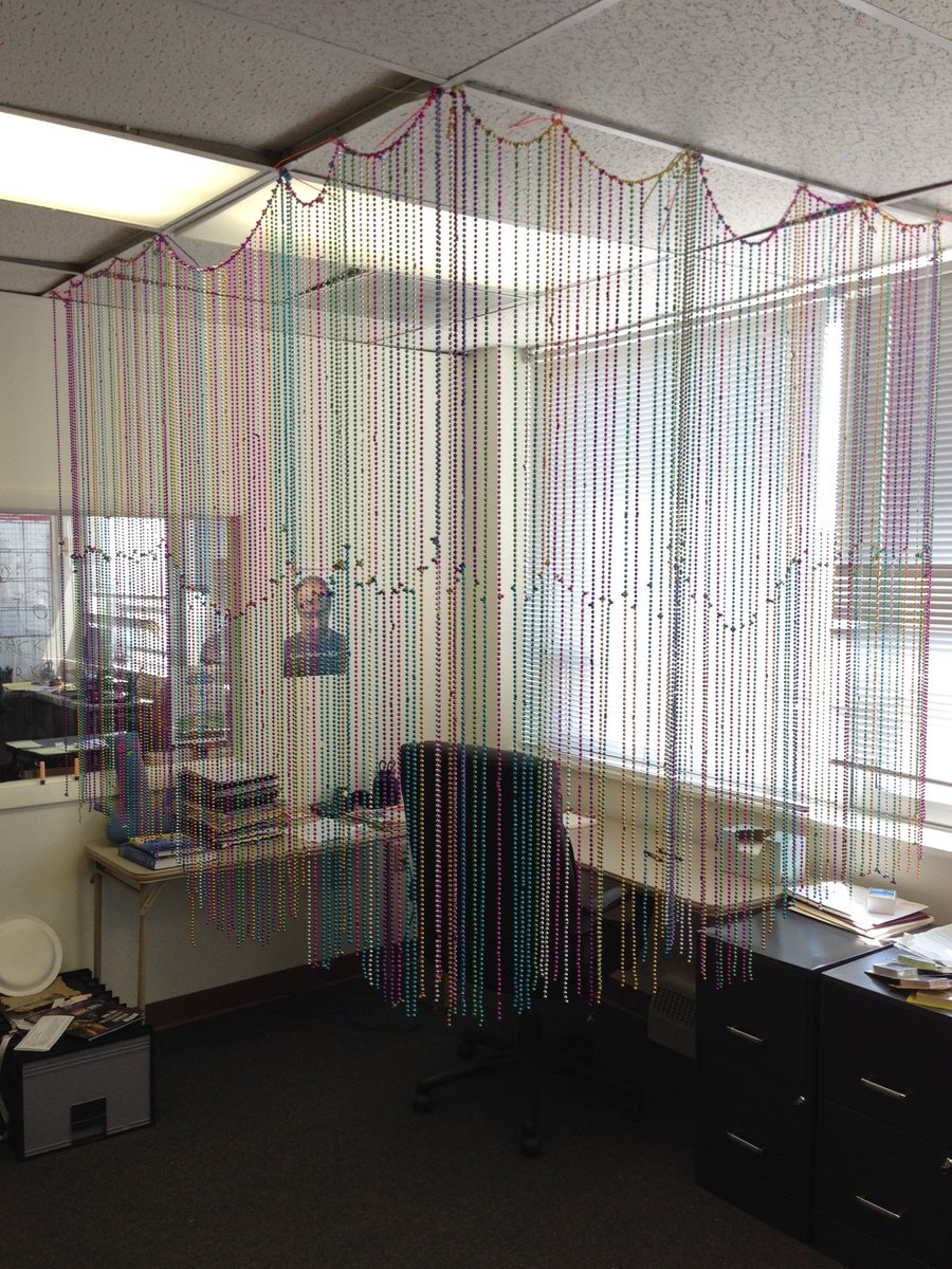 2014 office pranks. Satish's desk was turned into a corner office with a bunch of Mardi Gras beads.