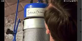 An event happens that startles Truman slightly awake.A lighting fixture falls from the set sky that he lives on.The name of the light fixture?SIRIUS.The brightest star in our world. 6/