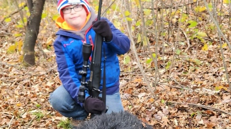 "After the bear treed, we walked 467 yards on rough terrain. Cameron's strength and energy were amazing; he's quite a trooper!" Virgil said, "My son's big smile and big eyes said it all!" #childswish #ussa #bearhunting #hunting <a href="/HuntingRealm/">Hunting Realm</a> <a href="/TheBigGameHunt/">BigGameHuntingBlog</a> @OutdoorWhiskey