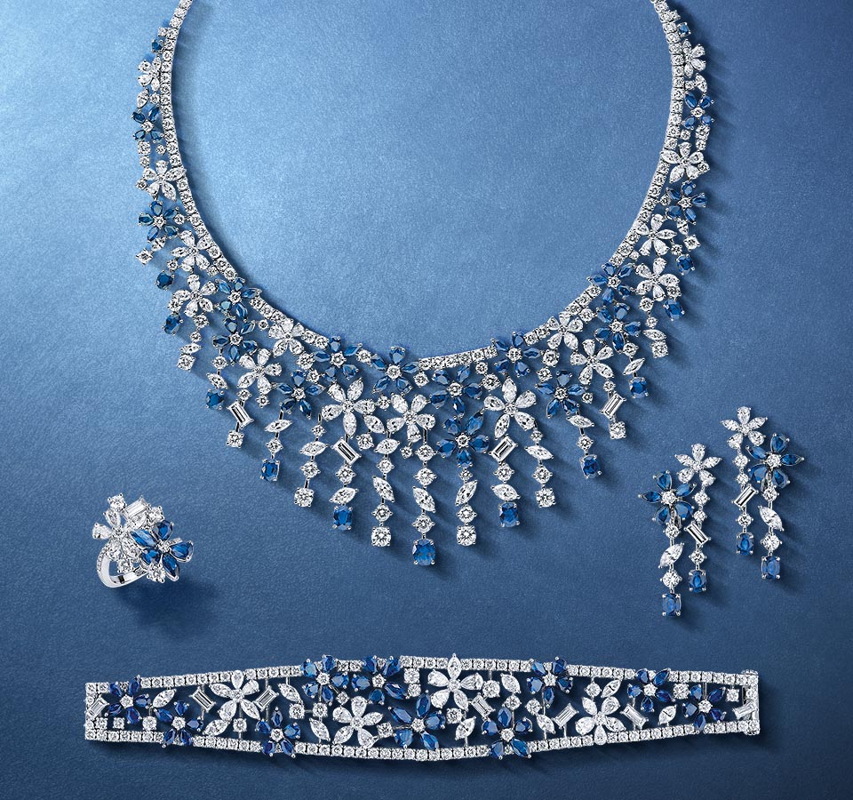 A suite from Mouawad. Almost definitely sapphires. They're based somewhere in the middle east and produce jewels almost entirely in suites.