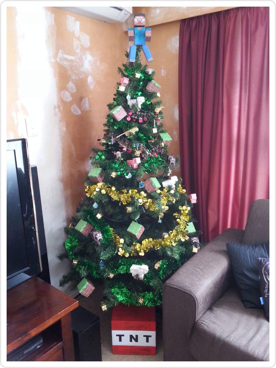 4 years ago the boys chose the theme, so it was a Minecraft Christmas. It was kind of ridiculously fun impaling a cardboard Steve on the top of the tree  The boys really loved making the decorations for this one.  #GeekChristmas