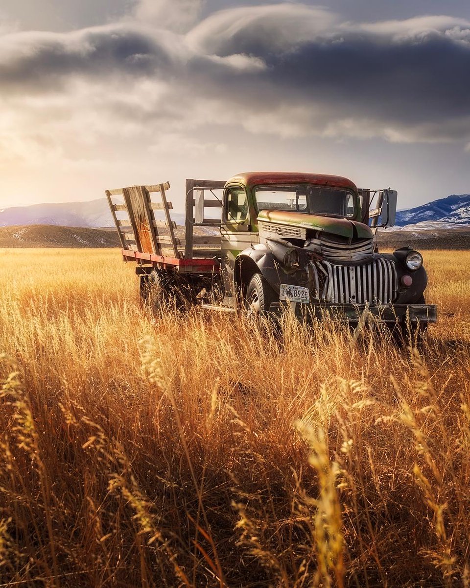 A photo by Ben Strauss of an old truck somewhere in the fields of Wyoming, USA.