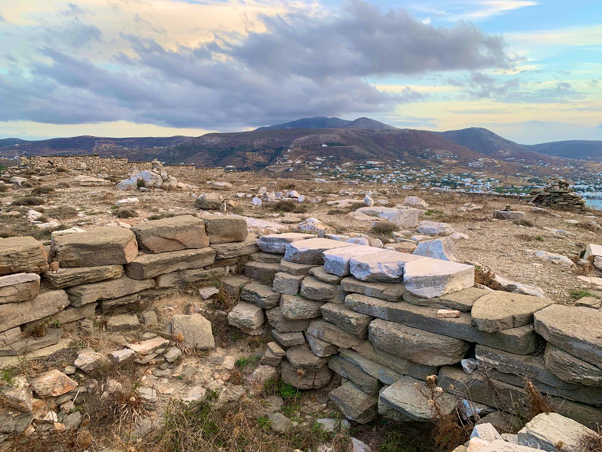 4/9 The deep foundations of the temple are still visible, and the rest of the architecture is scattered around the site, some organized in piles by the excavators and others built into the modern field boundaries that ring the Kynthos hill! – bei  Delion