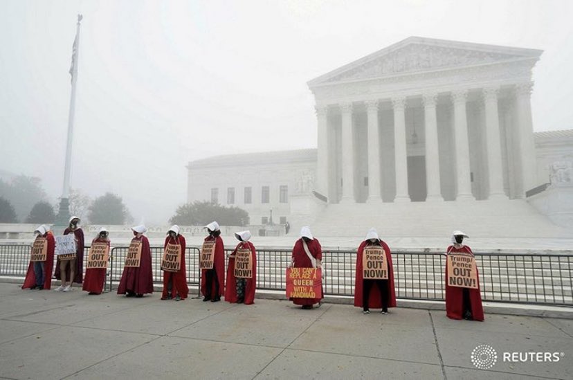 idreesali114's tweet photo. Activists dressed in Handmaid's Tale costumes rally in front of the Supreme Court to oppose the Supreme Court nomination of Judge Amy Coney Barrett in Washington, D.C., U.S., October 22, 2020. REUTERS/Ken Cedeno https://t.co/7xH5W6kETy