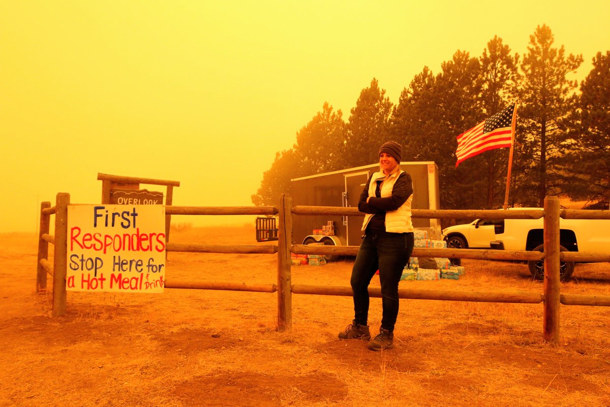 Nicole Casey lives at the top of this hill, where access to Glen Haven stops. She's been serving pallets of snacks and drinks to first responders. Flames haven't hit the small town, she said, in part thanks to firefighters who have been living down there in the smoke.