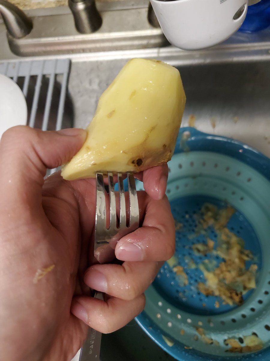 Take your raw ginger (above) and shave it naked (below)If the piece is shaped weird and you're afraid of shaving off a fingertip, stick a fork in it so you can keep your fingers on the bottom half.