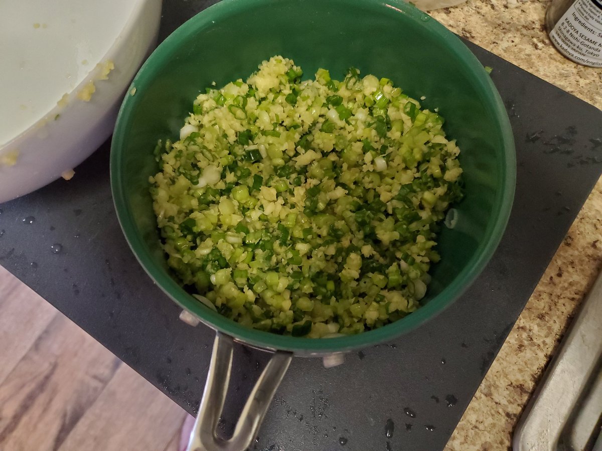 Add 1 teaspoon each of the salt, sesame oil, and MSG/soy sauce here, and mix thoroughly.I would also transfer them to a metal pot, for safety reasons involving the next step. Make sure they are spread out in a thin layer instead of piled up!