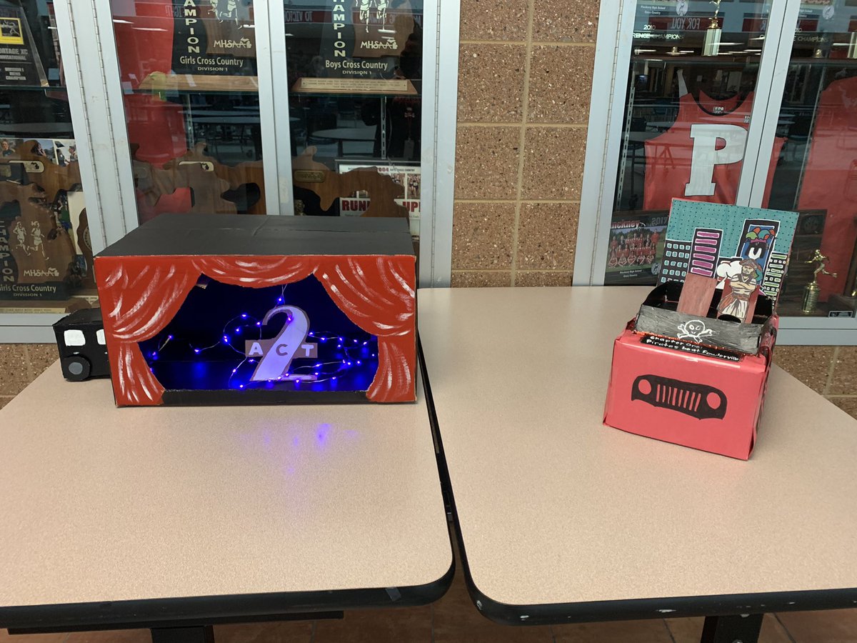PinckneyHigh's tweet photo. No traditional Homecoming experience? Leave it to student leaders to coordinate a creative alternative! Students were serenaded by the PCHS Choir, Orchestra, and Marching Band as they walked by club-created cardboard box “floats” and “reverse” paraded out of the building today! https://t.co/2jTA5h30jZ