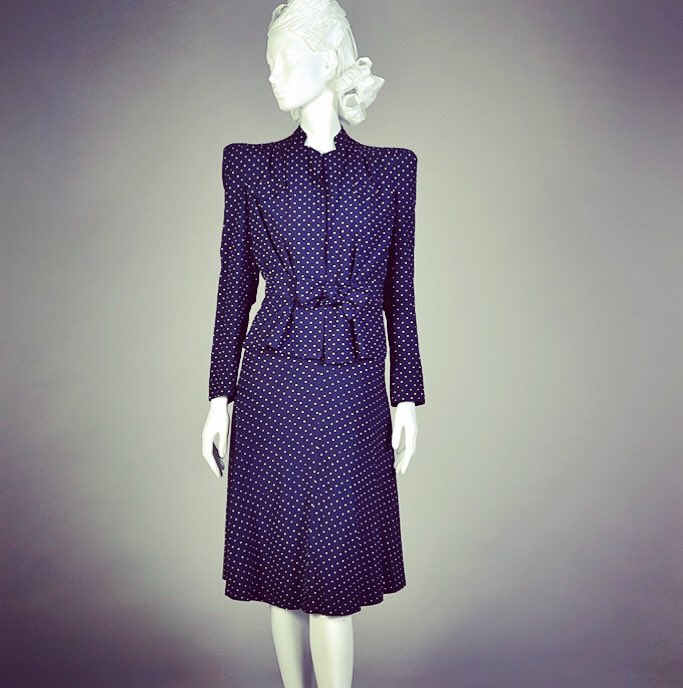 Dr Kate Strasdin (@katestrasdin) on Twitter photo #Polkadot perfection held in the strong shapes of a #1940s ensemble, the elongated shoulders that nip and tuck in elegant pleats to the waist. It is a suit that means business <a href="/KSUMuseum/">KSU Museum</a> #fashionhistory #Polkadot perfection held in the strong shapes of a #1940s ensemble, the elongated shoulders that nip and tuck in elegant pleats to the waist. It is a suit that means business <a href="/KSUMuseum/">KSU Museum</a> #fashionhistory