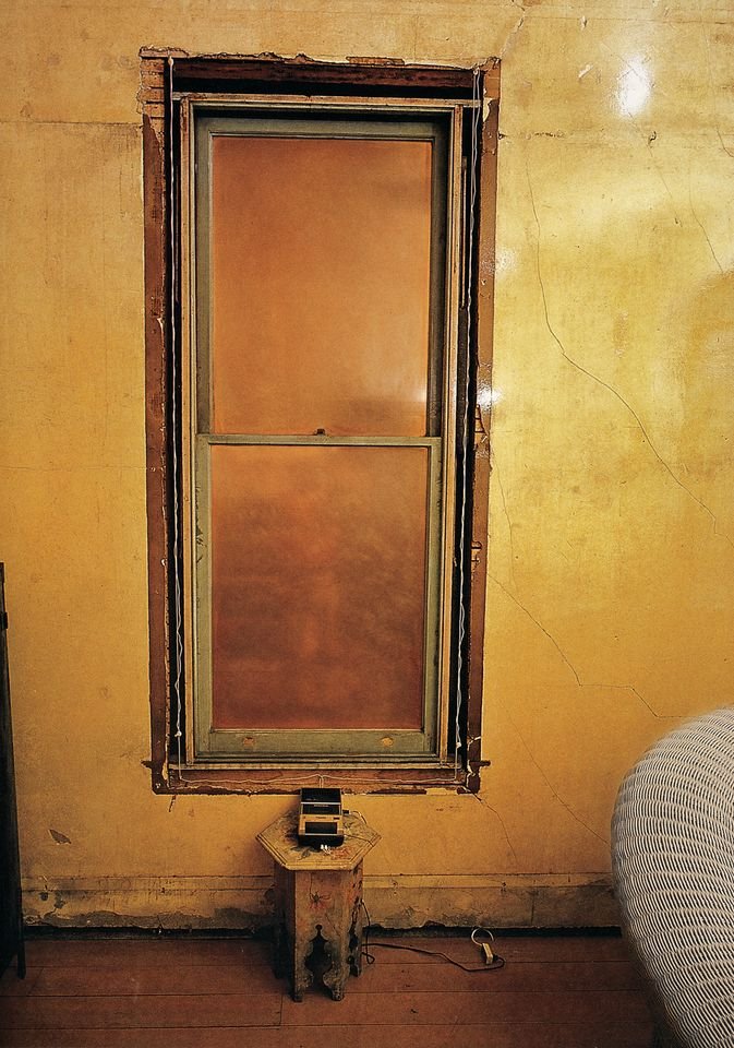 This house is located at 500 Capp St in San Francisco. The artist David Ireland bought it in 1975 for $50k and made the house itself into his art practice. One of the windows is completely sealed, but a tape recorder describes what he saw out the window on the day he sealed it.