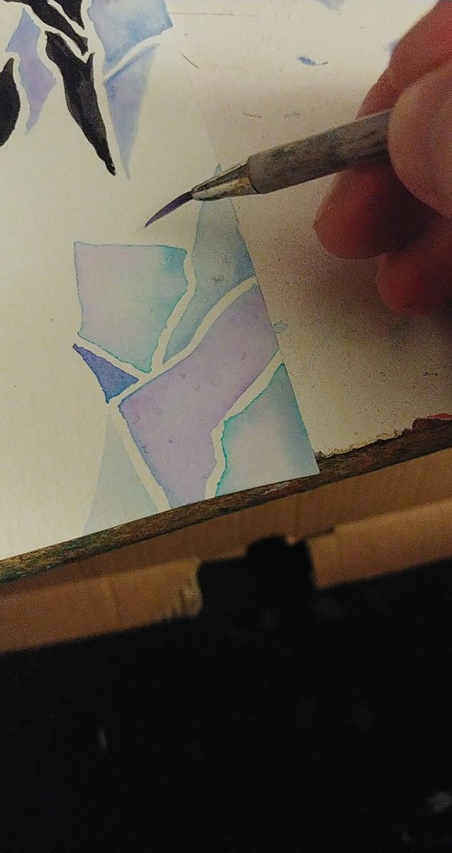 I chose a color pallete of cool icy blues and purples. I am randomly going in with my different colors, and I am painting small shapes