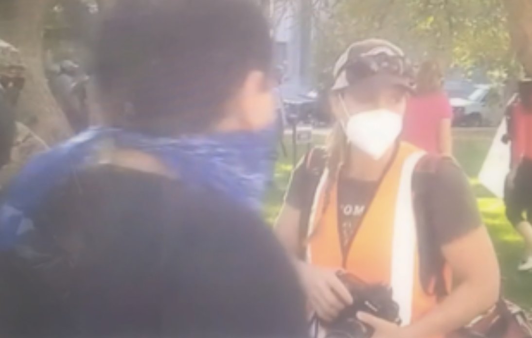 One video shows Orange Vest Photographer and BLM instigator seeming to acknowledge each other/communicate after OVP filmed up-close confrontation, and then crossing over to walk with each other across the street where shooting occurred. COZY!/5