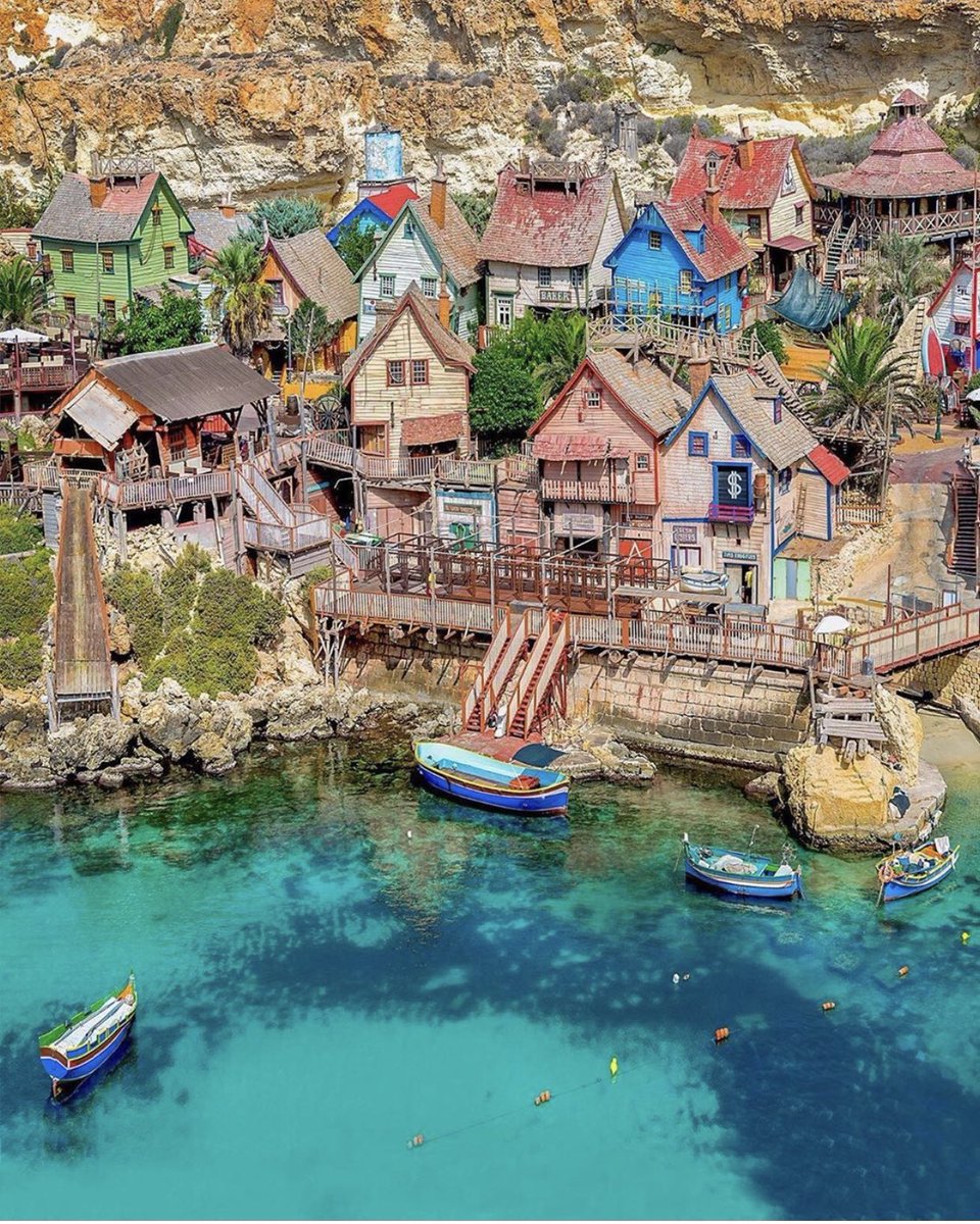 Int_MP's tweet photo. #PopeyeVillage, also known as #Sweethaven Village, is a group of rustic and ramshackle wooden buildings located in #Anchor Bay. It was built as a #film set for the production of the #Popeye movie, produced by #Paramount and #WaltDisney and starring #RobinWilliams https://t.co/VASC2y0vHs