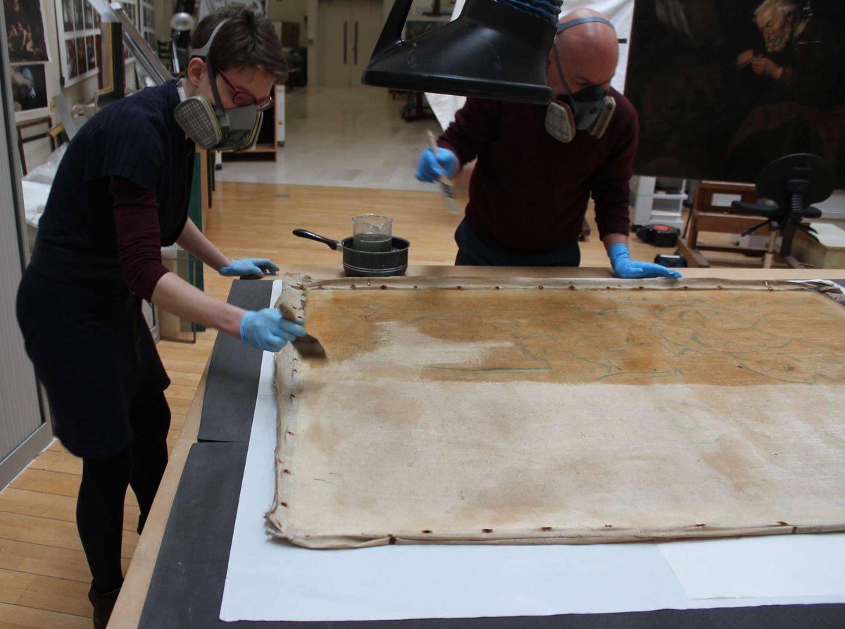 As the painting appeared to be suffering inherent fragility and potential future flaking issues, conservators opted for a full consolidation treatment by impregnating canvas, ground, and paint layers with a thermoplastic consolidant solution applied from the verso (reverse side).