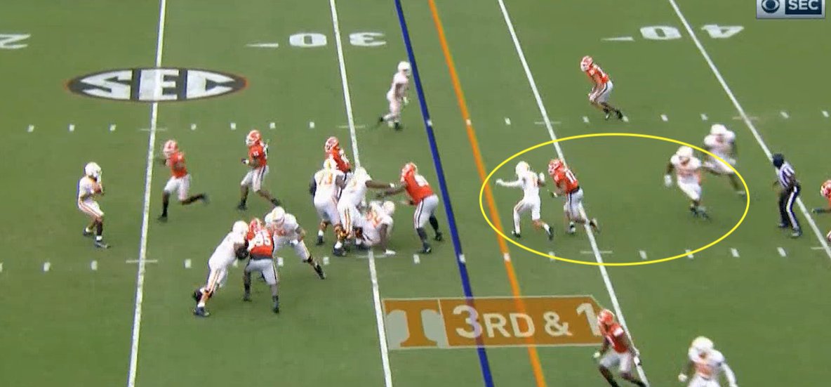 He can't throw hot to the RB, so he goes to his 2nd read - Hyatt on the crosser. The issue there is the receiver depths are wrong. They're way too far apart for the top crosser to rub this LB off of the bottom one. The LB is able to plaster Hyatt and take away the 2nd read, too.