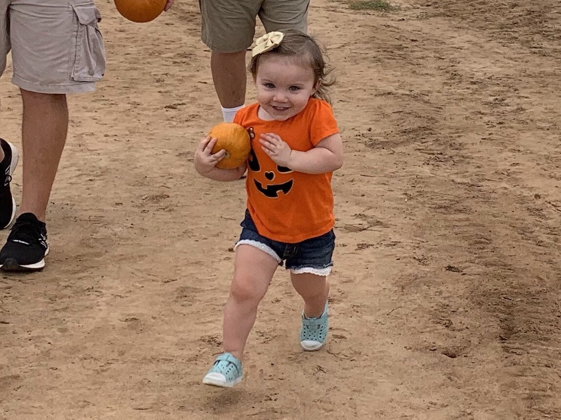 Jayden’s been paying attention ⁦<a href="/EHS__Football/">Enterprise Football</a>⁩ games this year. Running high and tight with the pumpkin she picked out.