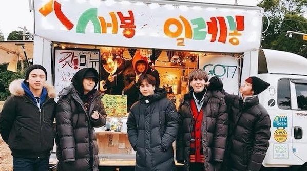 GOT7 Work eat Holiday in Jeju Island (2018):Four else of the boys having fun, preparing food and work at a food truck in Jeju during Look era!  https://www.vlive.tv/video/60019 Ps: I have only linked the first episode. copy the title and put your desired ep. on the search bar!