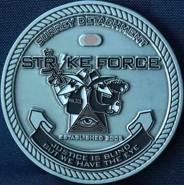 8/ It's a fascinating glimpse into police and enforcement culture. Here's the coin for the RCMP "Strike Force" in Surrey. They use the "All Seeing Eye" from the US $1 bill, and the Spy Vs Spy characters created to mock CIA/KGB during the Cold War.