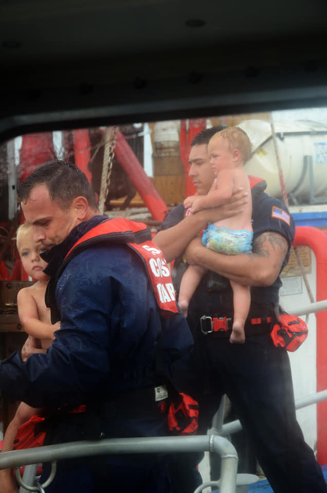 USCG's tweet photo. Heart-wrenching photos! #USCG Station Galveston and Air Station Houston assisted mariners and their families from 3 shrimping vessels that ran aground near #GalvestonIsland while evacuating #HurricaneDelta. #USCGDelta @USCGHeartland https://t.co/qcXe3ukkfI