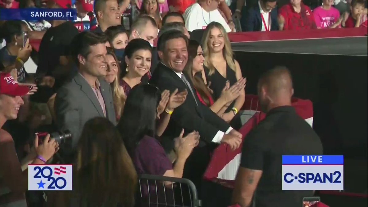 Ron DeSantis and his wife and Matt Gaetz are in a throng of Trump fans while not wearing masks