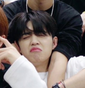 Seungcheol: "When you got into an argument but you know you're losing" kind of face
