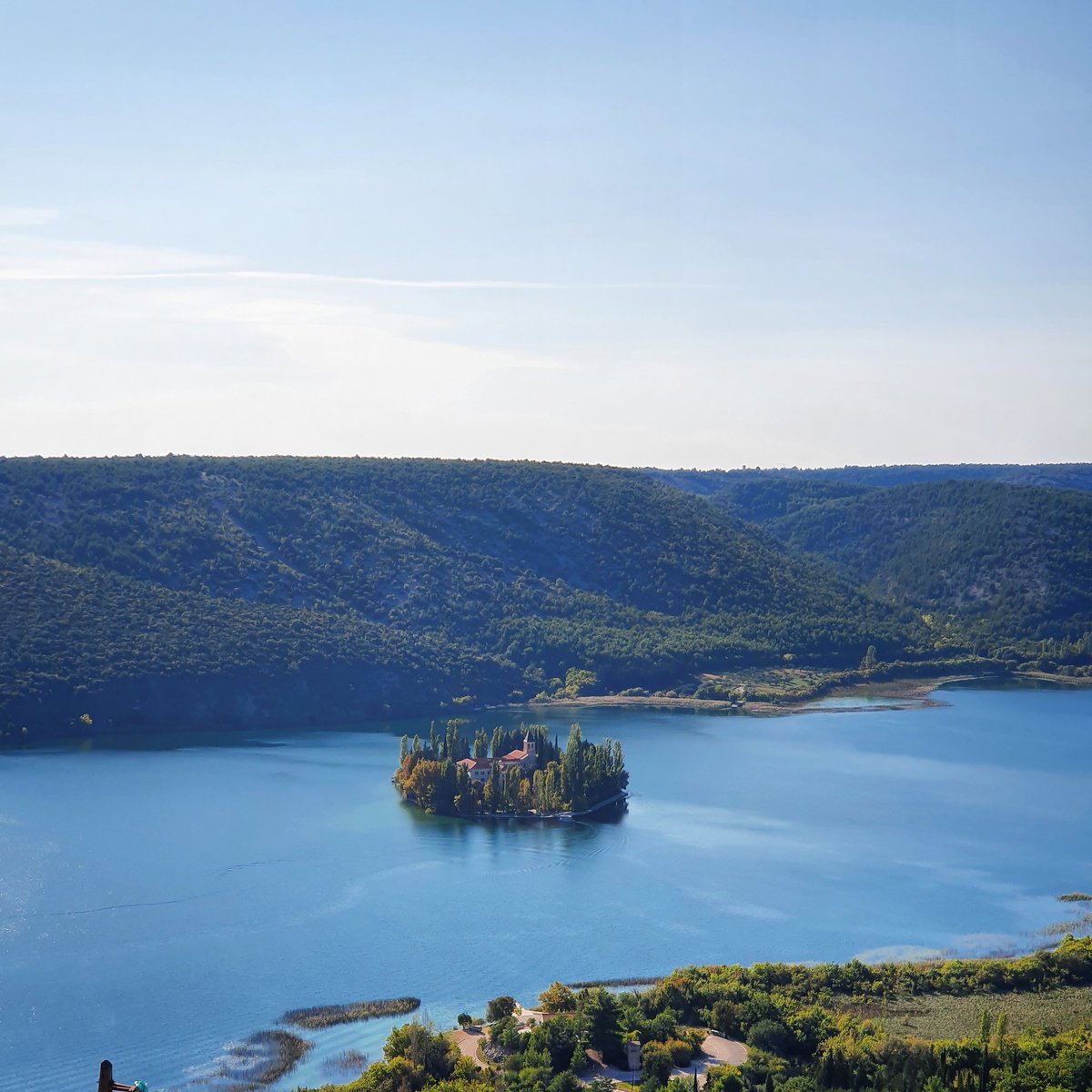 PrivateToursCro's tweet photo. About 6km upstream from Skradin, Visovac island is the site of a Franciscan monastery that dates from 1576. One of the world's most stunningly located monastery. @krkanationalpark @PrivateToursCro https://t.co/X68zl333H8