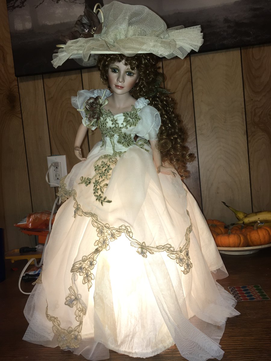 This is a doll/lamp we found at an auction. My daughter BEGGED for it. We brought it home and plugged it in. My partner noticed that it had real human hair. I said, "There is a zero percent chance that is not haunted." My daughter begged us to throw it away.