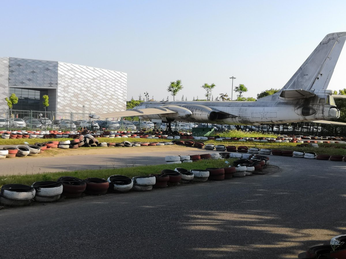 52 — China has a kind of innocence towards war. There's a park in Shanghai with bombs, fighter planes and an aircraft carrier. Kids are also allowed to watch bloody war movies, and visit the memorial in Nanjing with photos of the deeds done by Japanese. Elevators have gun ads.