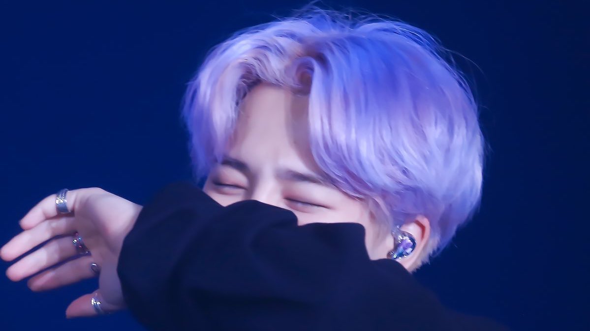 covering his mouth but still smiling with his eyes awh