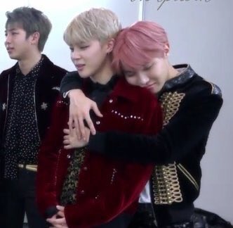 jihope hugs where they rest their heads on each other’s shoulders >