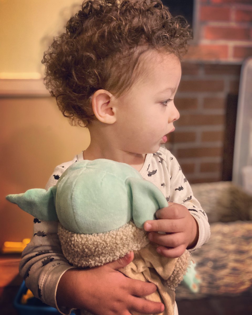 brittyinpink's tweet photo. Obsessed with his new baby Yoda. Carries him everywhere. https://t.co/ZUCYHabXP2