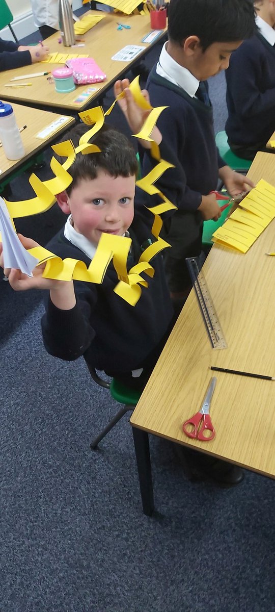 ElmsSchool's tweet image. Year 2 were given the task to try and fit themselves through a single sheet of a4 paper. With a lot of ideas and problem solving they managed to find the answer by cutting slits into the paper making a massive ring for them to fit into. #spaghettimaths #problemsolving  #gofurther