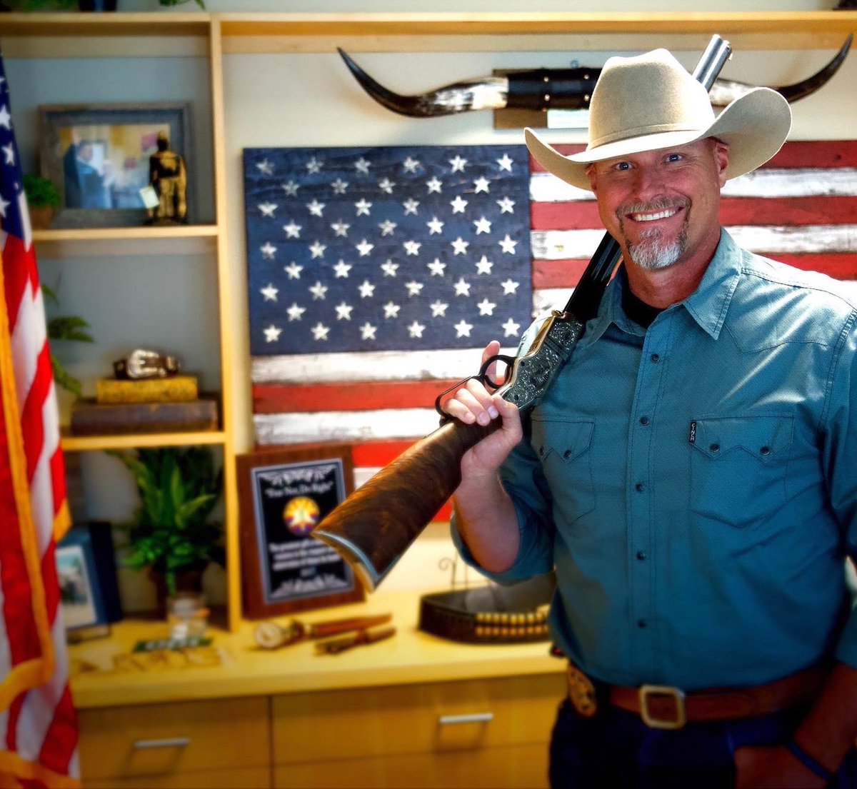 sherifflamb1's tweet photo. Why am I holding a rifle in my office?........Because I can. 🇺🇸 Let’s just take a moment to appreciate the Founding Fathers for giving us the Constitution that protects our God-given rights. #GodGunsFreedom Plus the @HenryRifles .44-40 lever action rifle is simply a masterpiece. https://t.co/zQWKLDrH2k