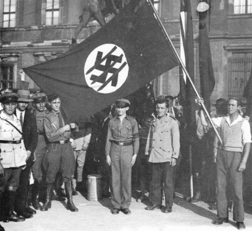 The three arrows (German: Drei Pfeile) logo was created by Sergei Chakhotin in 1931 for the Iron Front. According to the designer the inspiration came when he saw a swastika with one line crossing it out and thought three lines would better obfuscate the hate symbol.