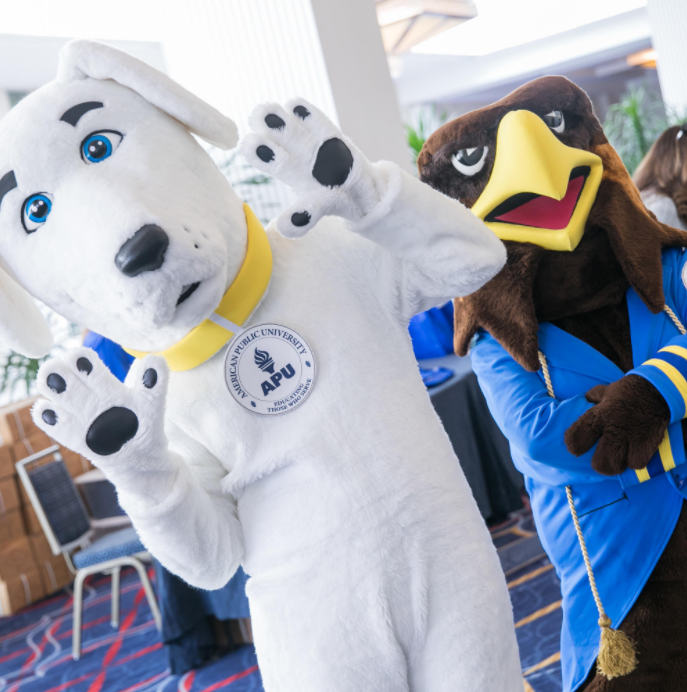 APUS_READ's tweet photo. Today is School Mascot Day! 

Share a photo of yourself with Jake, the APU volunteer mascot, or Valor, the AMU golden eagle mascot. Don't have a picture of a mascot? Go ahead and draw one yourself! 

#APUSReads #AMUValor #APUJake https://t.co/WpfwuL3bXX